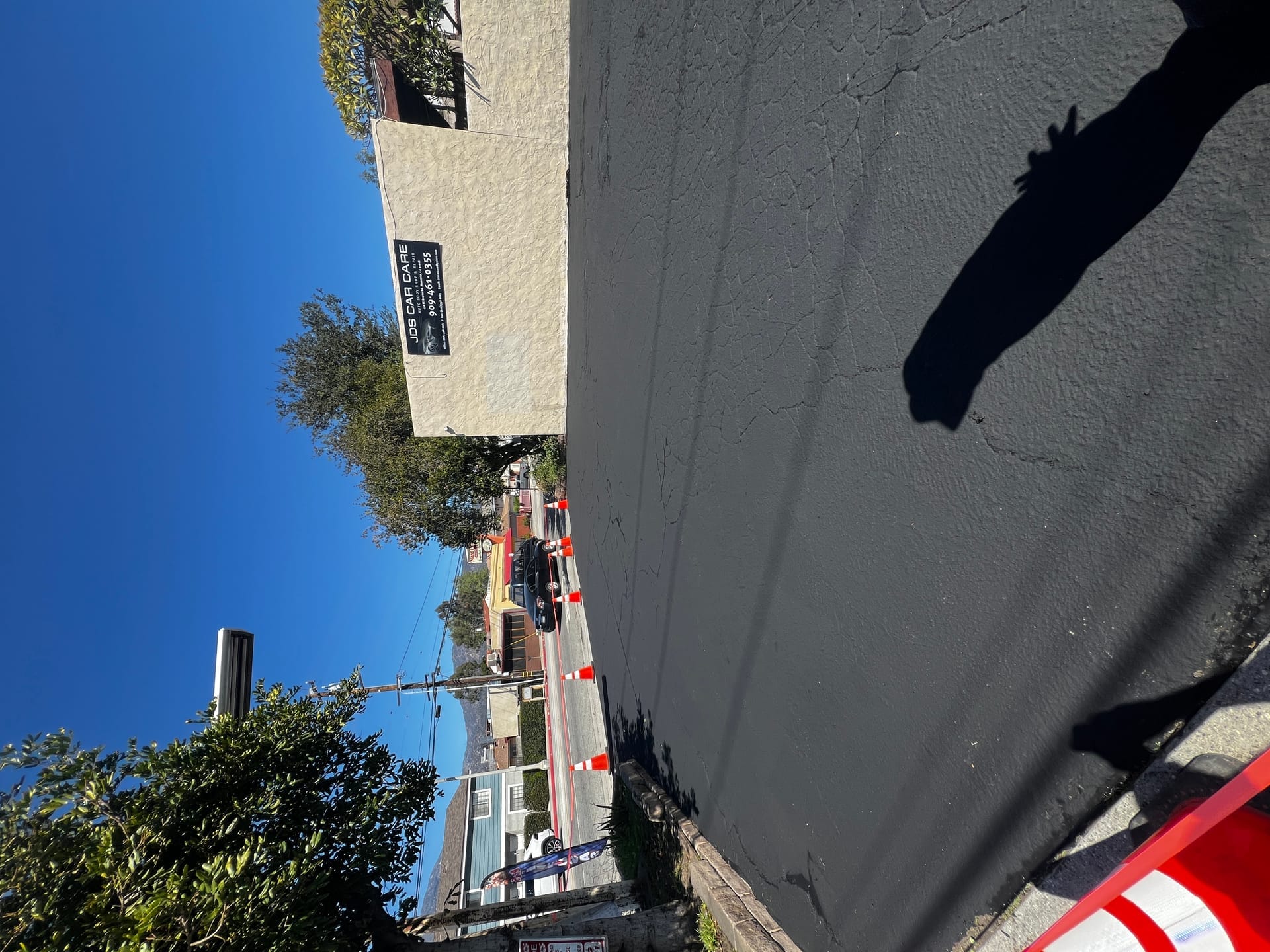 Fresh sealcoat application on asphalt